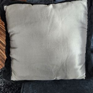 Silver pillow with black velour trim